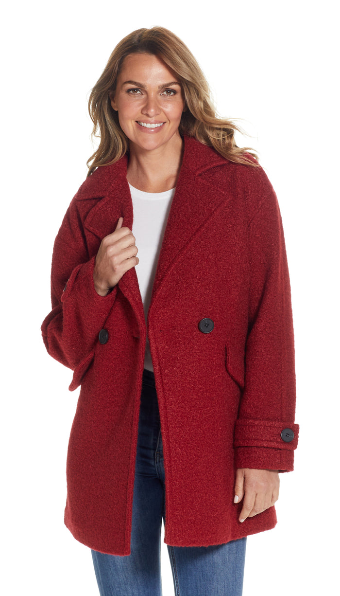 a woman in a red coat