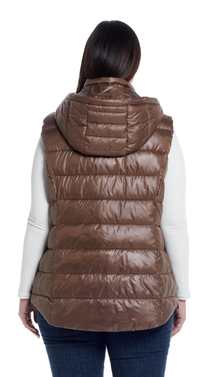 a woman wearing a brown vest