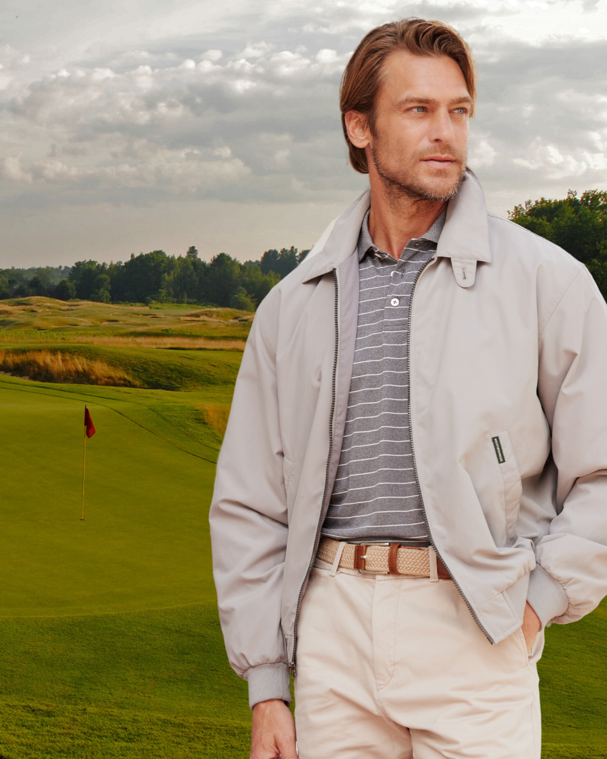 a man standing in a golf course